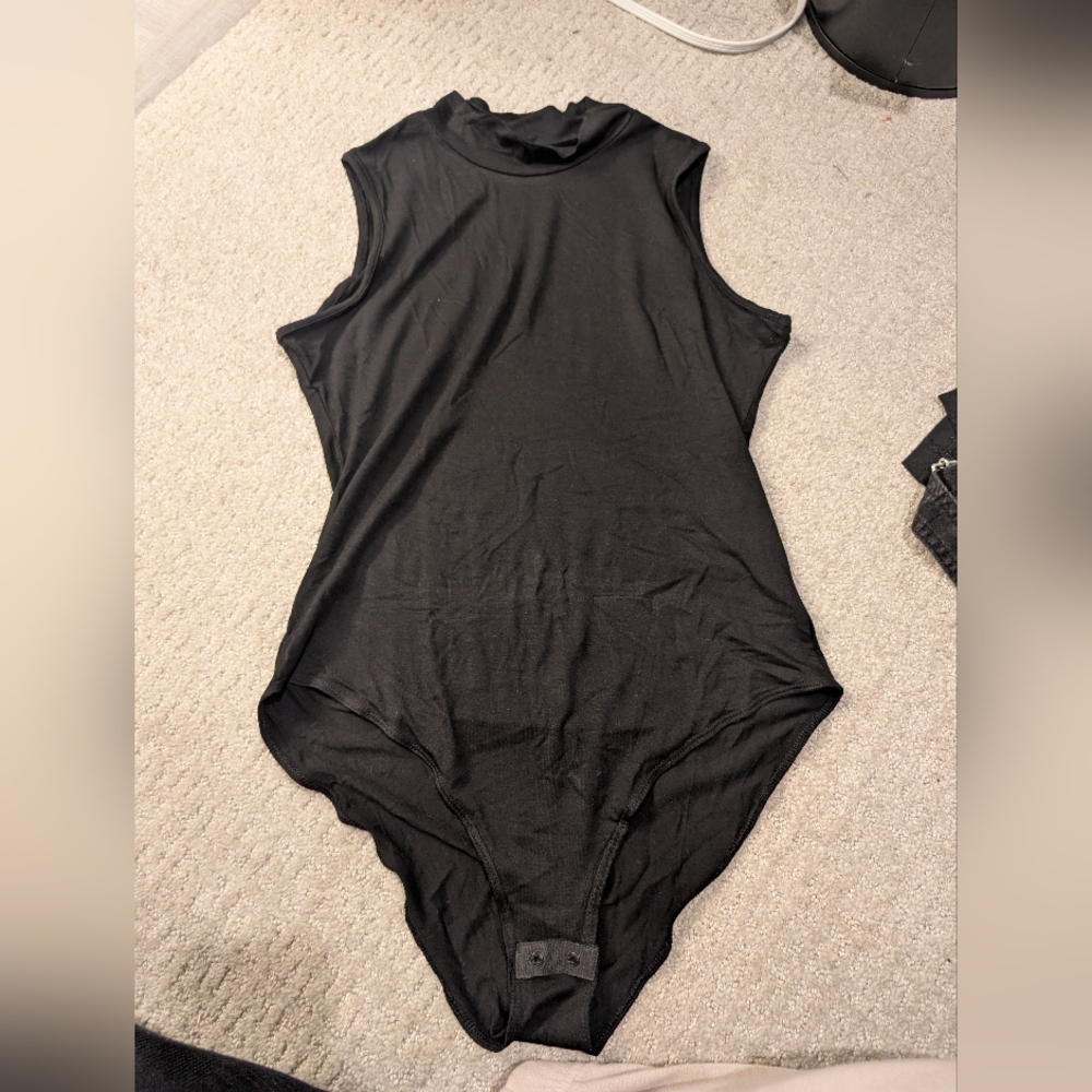 Sleeveless turtleneck bodysuit
